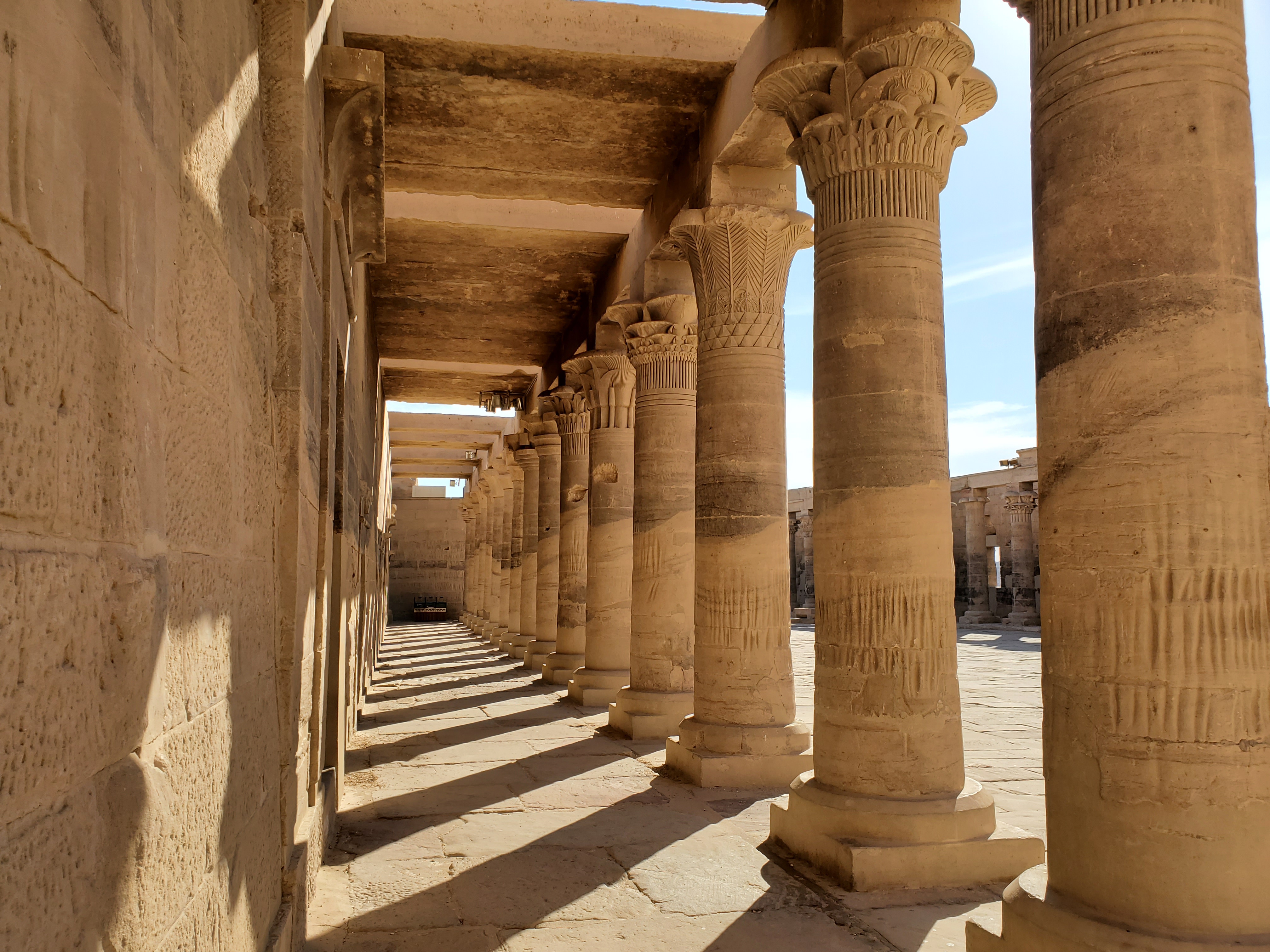 Sunlight shining through columns at Philae Temple, Aswan, Egypt