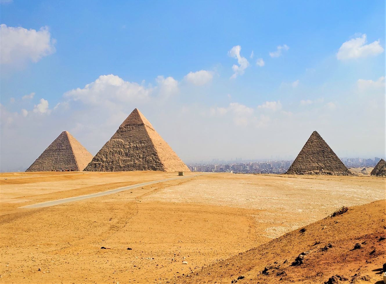 The giza plateau with the three large pyramids in the distance